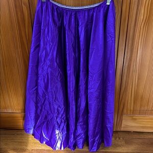 This is a shiny purple elastic waist skirt; not lined;just below the knee length